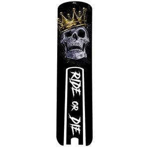 May include: Black and white skull graphic with a gold crown on top. The skull is wearing a crown and the text "RIDE OR DIE" is written in white on a black background.