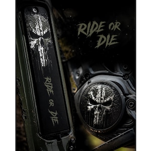 May include: A black motorcycle engine cover and frame component featuring a distressed white skull graphic and the text RIDE OR DIE in a jagged font. The design is applied to both a rectangular vertical panel and a circular engine casing cover.