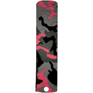 May include: A black, gray, and pink camouflage pattern phone grip with a hole for a finger.