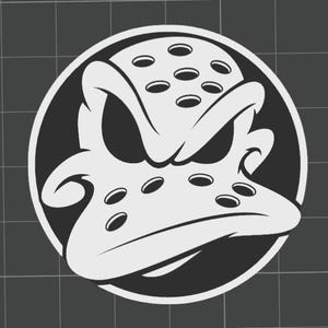 May include: A black and white graphic of a duck's face, set within a black circle. The duck has a stern expression, with a white outline and several oval-shaped holes on its head. The background is a dark gray grid.