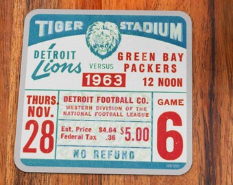 May include: A vintage ticket for a Detroit Lions vs. Green Bay Packers football game at Tiger Stadium on Thursday, November 28, 1963. The ticket cost $5.00 and reads "No Refund".