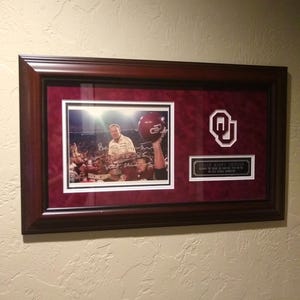 26 x 16 Barry Switzer Autographed Framed 1985 OU Photo Art | Certificate of Authenticity On Back of Art | Oklahoma Sooners Football Gifts