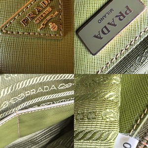 May include: Close-up of a green leather Prada handbag. The image shows the Prada logo in gold on a triangle-shaped patch and a rectangular patch. The interior lining is visible, along with a tag with the number 180.