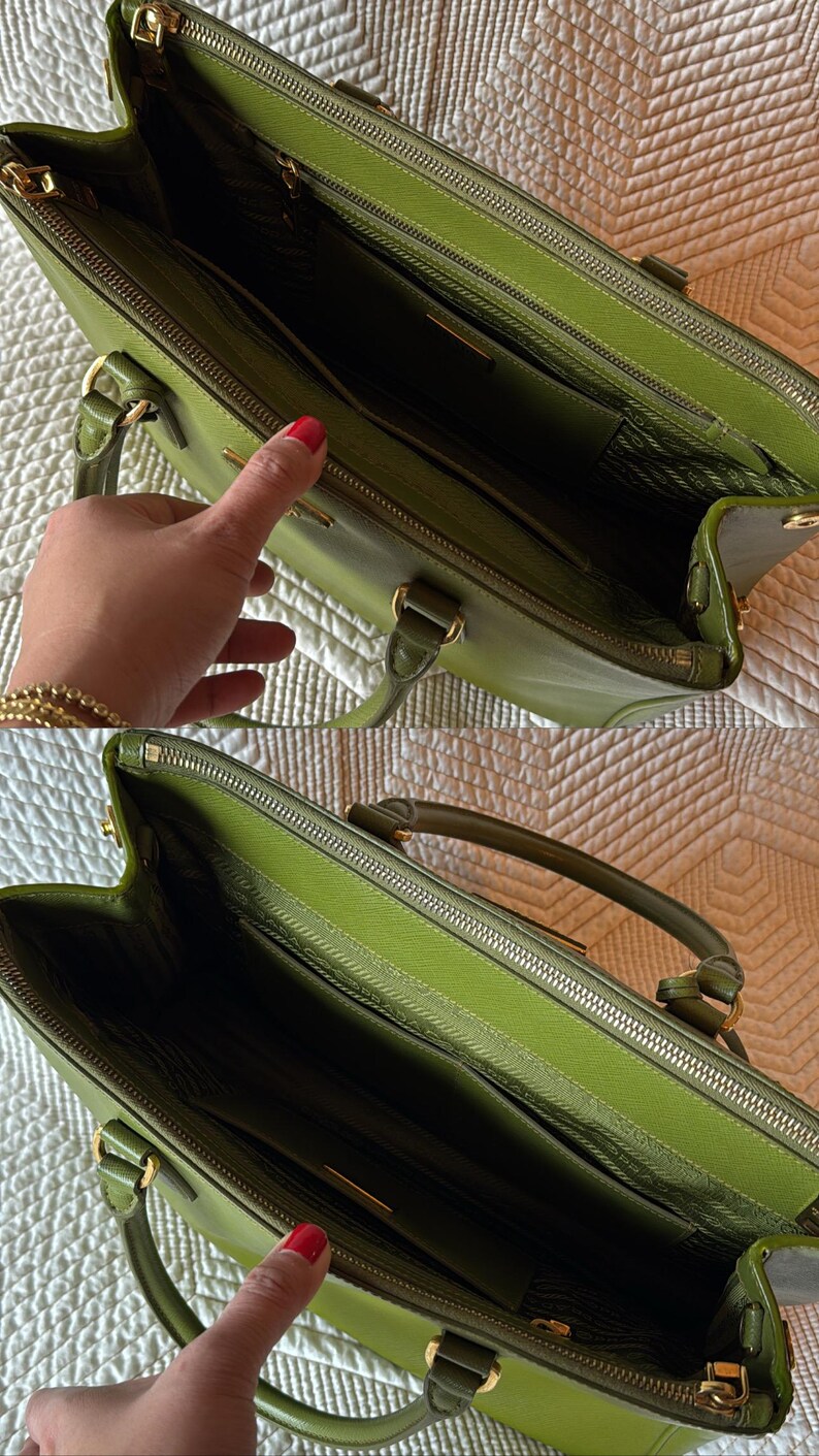 May include: A green leather handbag with gold-toned hardware. The bag has a top handle and a zipper closure. The interior is lined with a matching green fabric and features multiple compartments. The bag is open, revealing the interior.