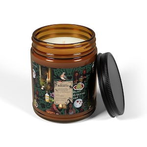 May include: A brown glass jar candle with a black lid. The candle has a green and brown label with illustrations and the text "Margaritas" and "You're always on my mind."