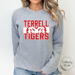 May include: Grey sweatshirt with red text that reads "TERRELL TIGERS" with a red tiger head graphic.