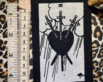 Three of Swords tarot card sew on patch. For Witchy goth battle vests, pants, occult backpacks. hand made, silk screened