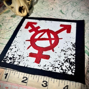 Trans anarchy, gender anarchy sew on punk patch