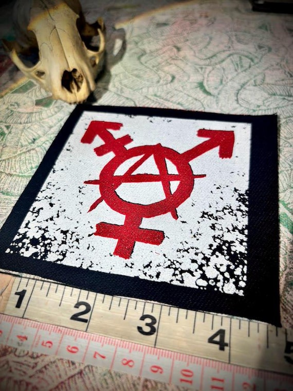 Trans anarchy, gender anarchy sew on punk patch