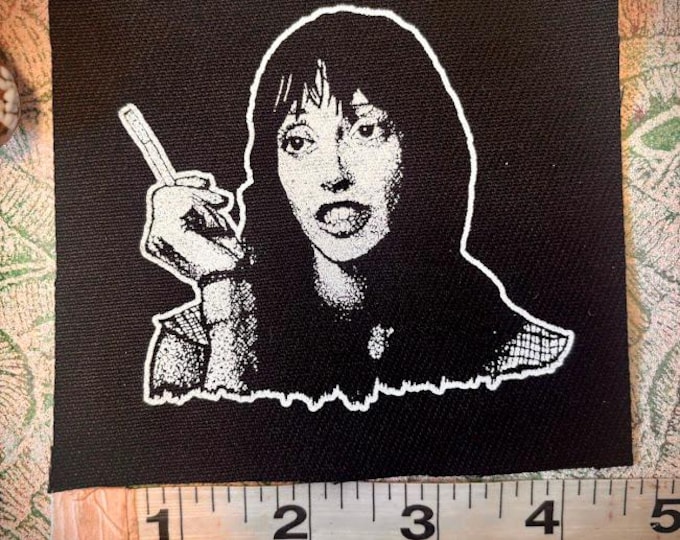 Wendy Torrance and her cigarette ash sew on punk patch