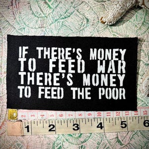 money to feed war, money to feed the poor sew on punk patch