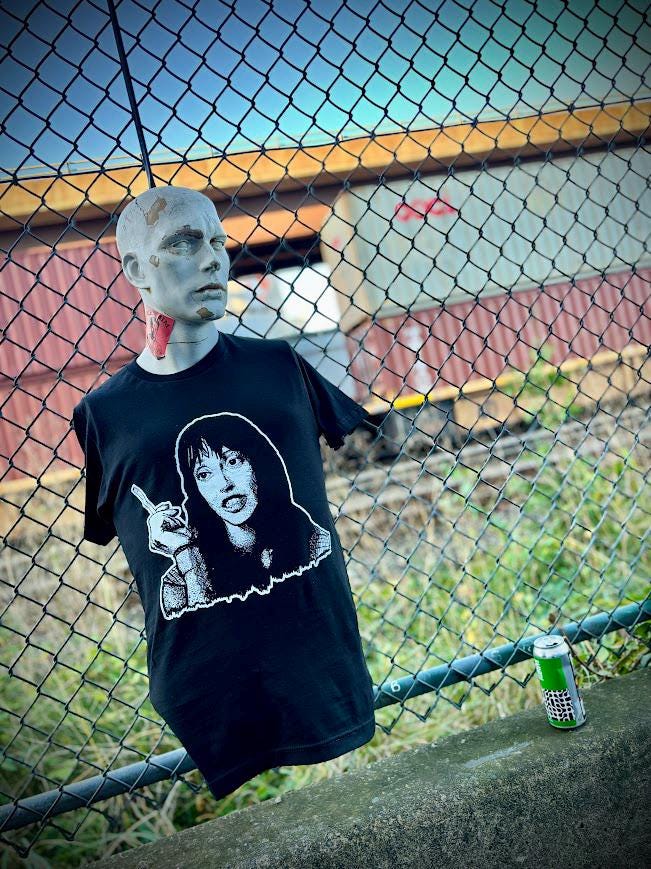 Wendy Torrance with her ultra long cigarette ash tee