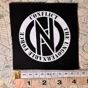 May include: A set of three ceramic mugs with a speckled, matte finish. The mugs are in shades of cream, light gray, and dark gray. Each mug has a simple, minimalist design, perfect for coffee or tea.