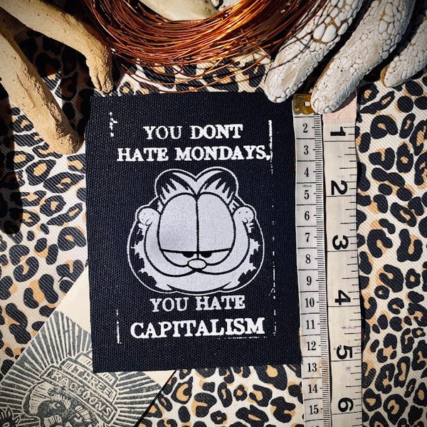 You don’t hate Mondays you hate capitalism with Garfield. For socialist punk battle vests, leftist crusty pant