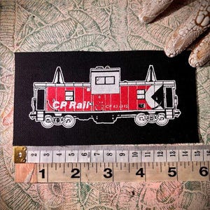 Écusson à coudre sur le dessin du wagon de queue de train du CP