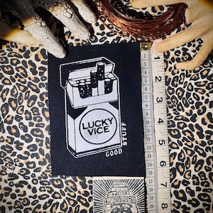 Lucky Vice Cigarettes sew on patch or pocket. patch with a pack of smokes on it, big enough to make a pocket for cigarettes. crust punk skid