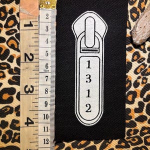 Toppa da cucire con tirazip 1312. Un po' di ACAB per la tua giacca da battaglia.