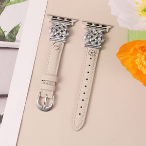 Close-up of Celtic floral knot connector on leather iWatch strap, symbolizing eternal love and unity