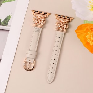 Rose gold hardware Apple Watch strap with cream leather and Celtic knot design, feminine and timeless