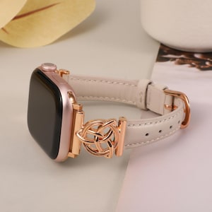 Premium black leather Apple Watch band with secure silver connector and symbolic Celtic charm.