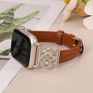 Brown leather apple watch band with silver Celtic charm, perfect for women who love vintage style