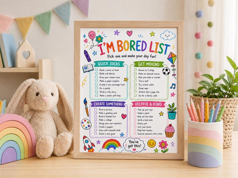 May include: A framed "I'M BORED LIST" with colorful illustrations and text. The list includes "Quick Ideas," "Get Moving," "Create Something," and "Helpful & Kind" activities. A plush bunny, rainbow stacker, and pencils in a pastel holder are in the foreground.