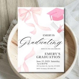 May include: Pink graduation invitation with a pink bow, graduation cap, and diploma. The text reads "Emery is Graduating. Join us to celebrate. Emery's Graduation. June 25, 2023 Saturday at 6:30 PM. 123 Anywhere St., Any City, ST 12345. RSVP To Emery 123-6565-787"