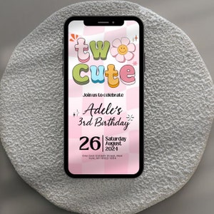 May include: A pink and white checkered phone screen with a colorful graphic that says "two cute" and a flower with a smiley face. The text below says "Join us to celebrate Adele's 3rd Birthday" and "26 Saturday August 2024". The address is "One East Sixtieth Street, New York, NY 10022-1054".