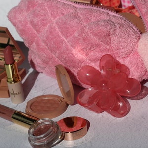 The Daily Essentials Makeup Bundle Gift with makeup bag wash cloth and hair clip lipstick eyeshadow lip gloss blush