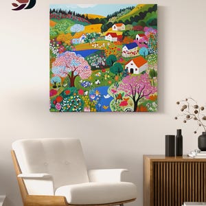 a living room with a white chair and a painting on the wall