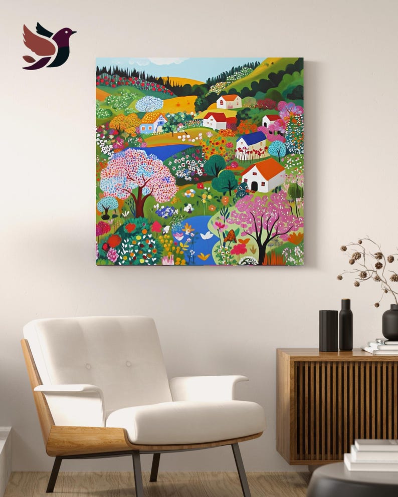a living room with a white chair and a painting on the wall