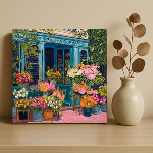 a vibrant flower shop with a variety of colorful flowers and plants displayed in pots and vases.