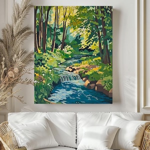 a living room with a couch and a painting on the wall