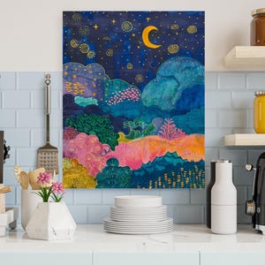a painting on a wall above a kitchen counter
