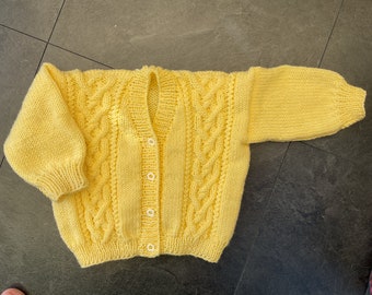 Hand knitted baby cable cardigan in Yellow. 1-2 yrs.