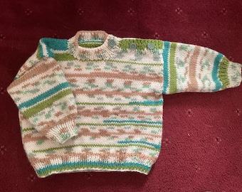 Hand knitted baby jumper in greens, browns & white.