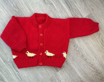 Hand knitted baby Easter cardigan in Red with chickens.