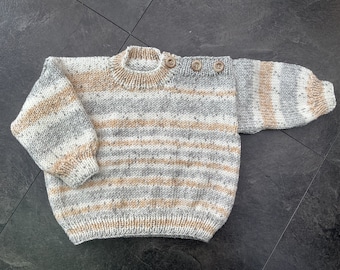 Hand knitted baby jumper in Brown, Greys & White.