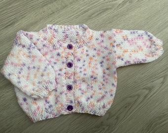 Hand knitted baby cardigan in White with multi colours. 0-3 mths.