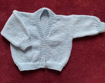 Hand knitted baby cardigan in Blue with White fleck. 1-2 yrs.