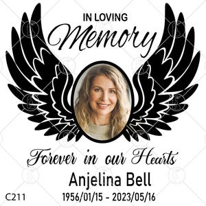 May include: A memorial design featuring a photo of a woman within an oval frame, surrounded by black angel wings. The words "In Loving Memory" and "Forever in our Hearts" are displayed above and below the photo, along with the name Anjelina Bell and dates.