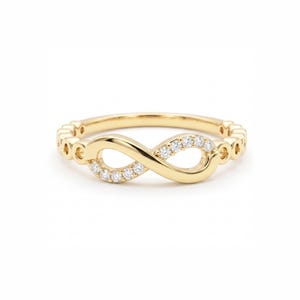 Anillo llamativo de oro de 14 quilates con moissanita de talla redonda y cadena de eslabones infinitos, símbolo delicado, ideal para apilar, regalo de compromiso o aniversario.