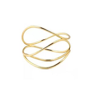 May include: A gold-colored cuff bracelet with a flowing, open design. The bracelet features multiple curved bands that intertwine to create an abstract, elegant look. The metal has a polished finish, reflecting light.