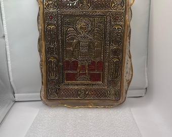 Byzantine style icon under glass with gold background