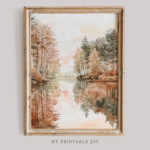 May include: A watercolor painting of a lake surrounded by trees in autumn colors. The water reflects the trees and the sky, creating a peaceful and serene scene.