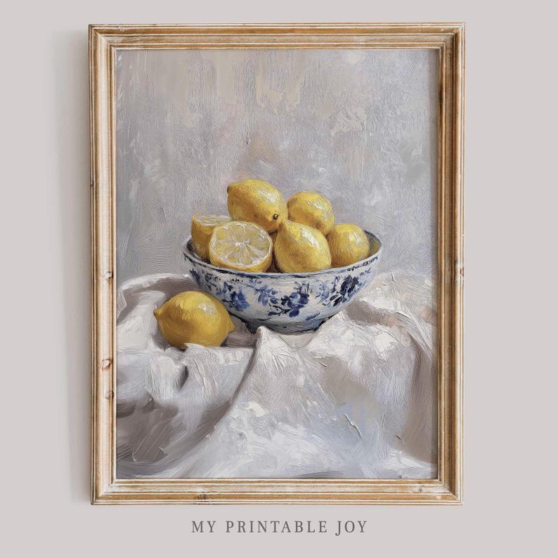 May include: A painting of a bowl of lemons on a white tablecloth. The bowl is blue and white with a floral pattern. The lemons are yellow and some are cut in half.