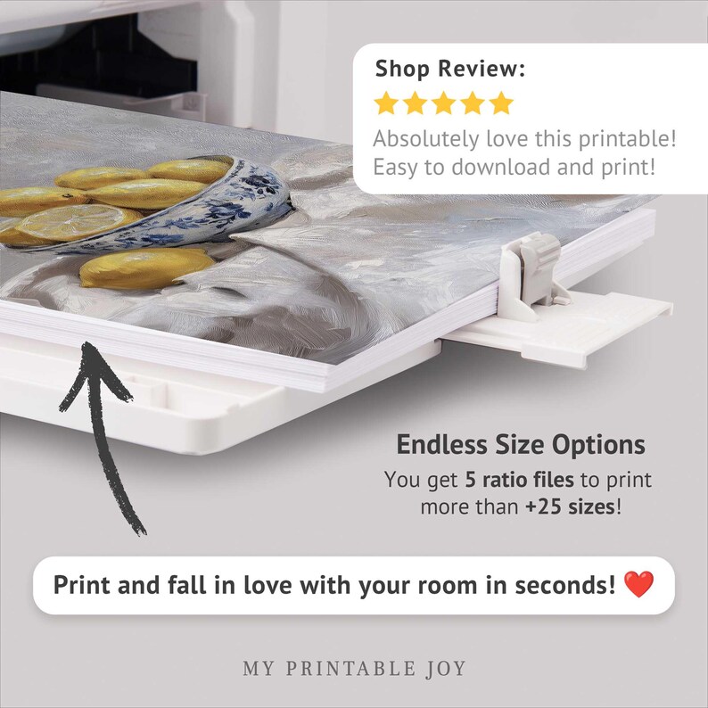 May include: A printable art print of a bowl of lemons on a white surface. The image is being printed on a printer. The text "Shop Review: Absolutely love this printable! Easy to download and print!" is visible in the top right corner of the image. The text "Endless Size Options You get 5 ratio files to print more than +25 sizes!" is visible in the bottom right corner of the image. The text "Print and fall in love with your room in seconds!" is visible in the bottom center of the image. The text "MY PRINTABLE JOY" is visible in the bottom center of the image.