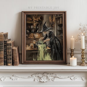 May include: A framed print depicting a witch stirring a bubbling green potion in a cauldron. The witch is wearing a black dress and hat. The print is in a dark wooden frame and is displayed on a white mantelpiece with candles and books. The text "MY PRINTABLE JOY" is at the top.