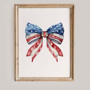 Puede incluir: Una pintura de acuarela de un lazo rojo, blanco y azul con un patrón de estrellas. El lazo tiene la forma de un lazo tradicional con un nudo central.