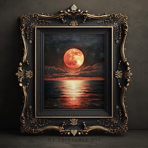 May include: A framed print of a seascape featuring a large, orange moon over the ocean. The artwork is set in an ornate black and gold frame. The print is labelled "MY PRINTABLE JOY" at the bottom.